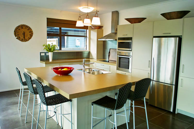 a kitchen with a table and chairs